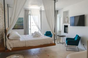 TV a/nebo společenská místnost v ubytování Antico Mondo Rooms & Suites
