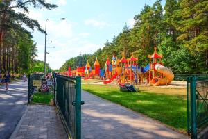 a park with a playground with a slide at Amber-Blue Palanga in Palanga