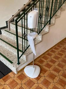 a white toilet in front of a staircase at Frühstückspension Josefinum in Bad Aussee