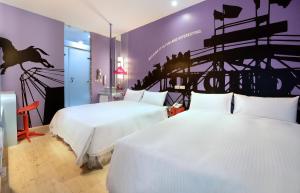 Postel nebo postele na pokoji v ubytování NL Concept Hotel + 17 fotografií