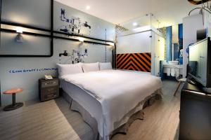 Postel nebo postele na pokoji v ubytování NL Concept Hotel