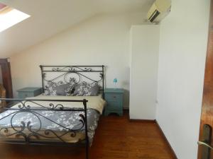 Postel nebo postele na pokoji v ubytování Casa Ligia