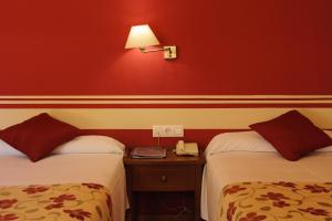 Postel nebo postele na pokoji v ubytování Hotel Dunas Puerto