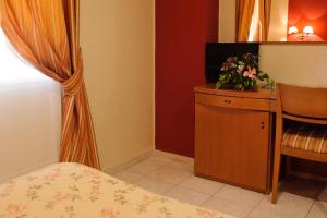 TV a/nebo společenská místnost v ubytování Hotel Dunas Puerto
