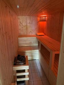 an empty sauna with a stove in it at Holidayhome in Hannover