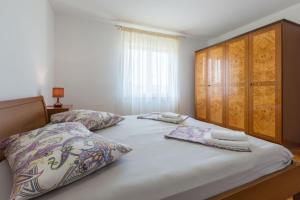 Posteľ alebo postele v izbe v ubytovaní Lovely House LINDI in Poreč