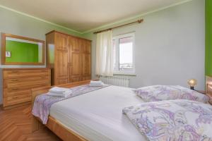 Posteľ alebo postele v izbe v ubytovaní Lovely House LINDI in Poreč