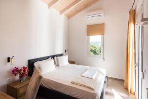 Postel nebo postele na pokoji v ubytování Villa Kiara 2
