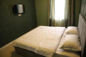 Postel nebo postele na pokoji v ubytování Hotel Gold