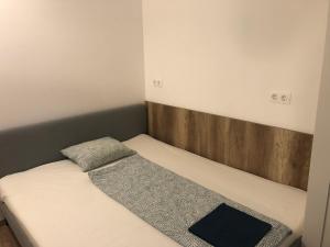 Postel nebo postele na pokoji v ubytování Omega Apartments Budapest