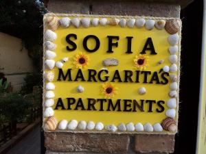 a yellow sign that says santa margarita margarita appliances appliances at Sofia Margarita's Rooms in Agios Gordios