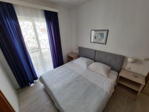 מיטה או מיטות בחדר ב-Apartments Adrion