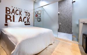 Postel nebo postele na pokoji v ubytování NL Concept Hotel