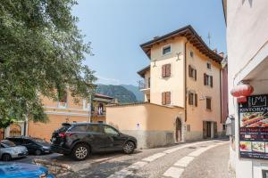 a car parked on a street next to a building at Piccola Corte in Arco