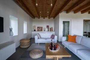 a living room with a couch and a table at Villa Ella in Vojnovo Selo