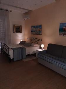 Postel nebo postele na pokoji v ubytování PONTE VALLE B&B POMPEI