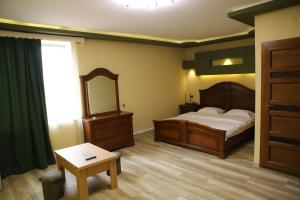 Postel nebo postele na pokoji v ubytování Hotel Gold