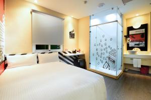 Postel nebo postele na pokoji v ubytování NL Concept Hotel