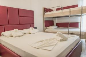 two beds in a room with two bunk beds at Katerina's Resort in Sarti
