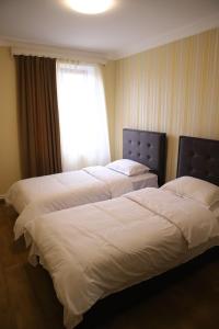 Postel nebo postele na pokoji v ubytování Hotel Gold