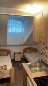 Ένα ή περισσότερα κρεβάτια σε δωμάτιο στο Vila Marina