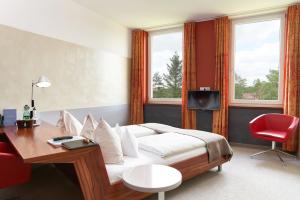 Ein Bett oder Betten in einem Zimmer der Unterkunft Hotel Maxlhaid