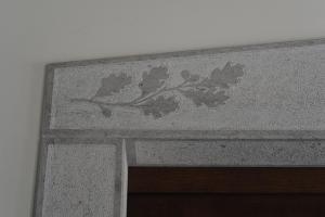 a stone wall with a painting of flowers on it at Hotel & Restaurant Pahor in Doberdò del Lago