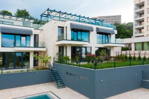 a large white building with a lot of windows at Buena Vista Villas in Varna City
