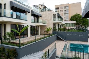 an image of a building with a swimming pool at Buena Vista Villas in Varna City