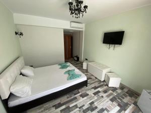 Postel nebo postele na pokoji v ubytování Cool Breeze - Mamaia Nord