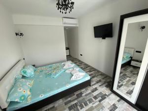 Postel nebo postele na pokoji v ubytování Cool Breeze - Mamaia Nord