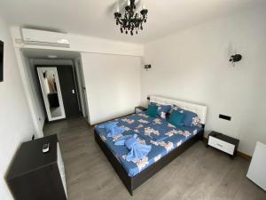 Postel nebo postele na pokoji v ubytování Cool Breeze - Mamaia Nord