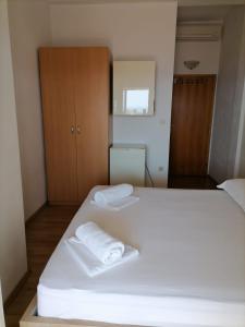 Postel nebo postele na pokoji v ubytování Steko Accomodations