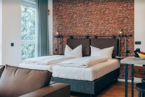 Un pat sau paturi într-o cameră la Weekly Boardinghouse