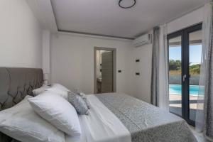 Ένα ή περισσότερα κρεβάτια σε δωμάτιο στο Villa Speranza +50 φωτογραφίες