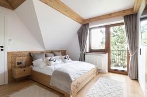 Posteľ alebo postele v izbe v ubytovaní Willa MAJA Relax pod Giewontem APARTZAKOP