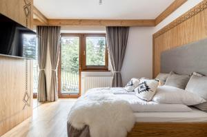 Posteľ alebo postele v izbe v ubytovaní Willa MAJA Relax pod Giewontem APARTZAKOP