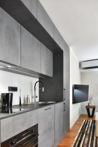 Kuchyň nebo kuchyňský kout v ubytování Lux Luna apartments & rooms Old town + 15 fotografií
