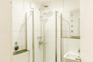 a bathroom with a shower and a sink at Bocksbergblick Fewo BB 02 in Hahnenklee-Bockswiese