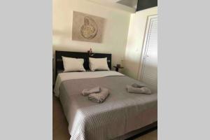 Posteľ alebo postele v izbe v ubytovaní Cozy seafront loft - Kat's rentals