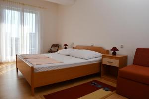 Posteľ alebo postele v izbe v ubytovaní Apartmani Zdenka 1