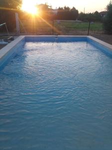 The swimming pool at or close to Holiday home next to orange tree orchard