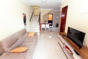 Μια τηλεόραση ή/και κέντρο ψυχαγωγίας στο Casa Paraíso na Praia de Peroba, Maragogi