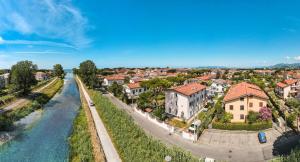 an aerial view of a town next to a river at Hotel Villa Giada in Marina di Massa