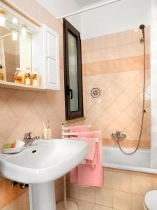 a bathroom with a white sink and a shower at Residenza Nobel Appartamenti in Rimini +83 photos