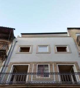 a white building with a balcony at D&S - Porto São Bento Apartments II in Porto