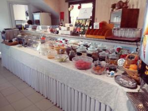 a buffet line with many different types of food at Hotel Oceanis in Poros