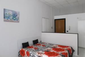 Posteľ alebo postele v izbe v ubytovaní Gardenia Napoli