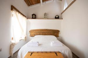 Uma cama ou camas num quarto em Villa Jumpadu