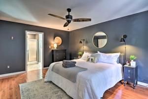 a bedroom with a large bed and a ceiling fan at Creekside Brevard Home Less Than 1 Mi to Downtown! in Brevard